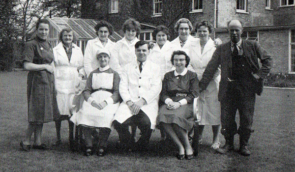 1963 Staff photo with the superintendent Mr Edwin Softley seated in the centre